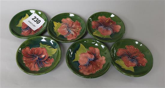 A set of six Moorcroft Hibiscus pattern trinket dishes 8cm